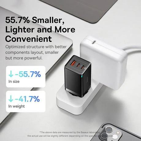 Compact black USB charger with multiple ports for electronic devices.