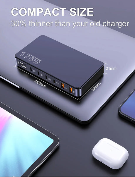 Compact multi-port charging device with digital display and multiple USB ports.