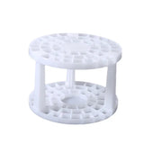 a white plastic cake stand with three tiered sections