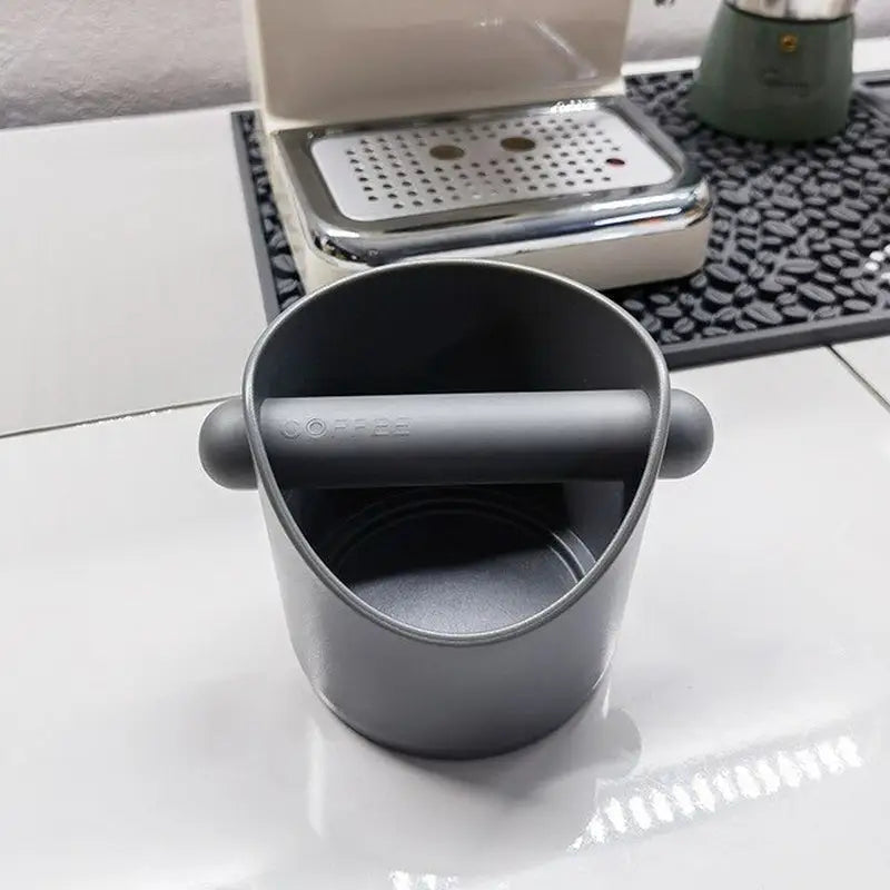 a cup with a lid on a table