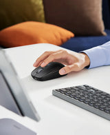 Computer mouse being operated by a hand.