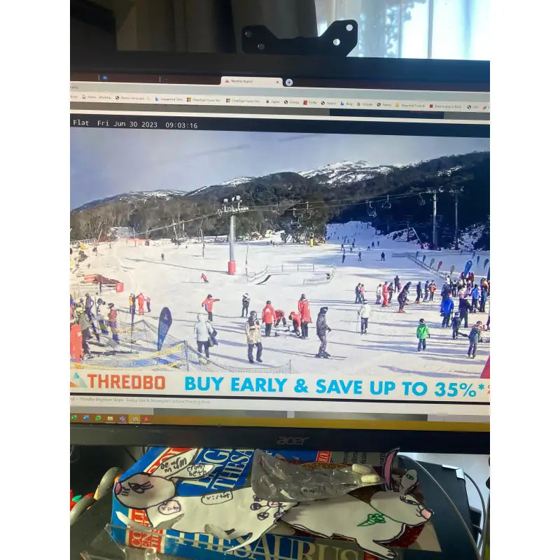 a computer screen showing a video of a ski slope