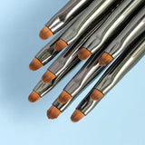 a set of brushes on a blue background
