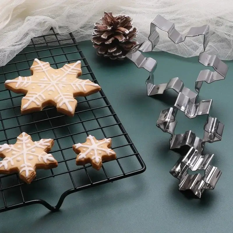 a cookie cutter and cookie cutters on a cooling rack