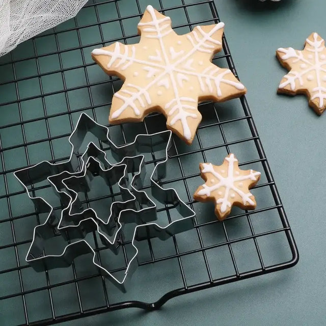 a cooling rack with cookies and icing on it