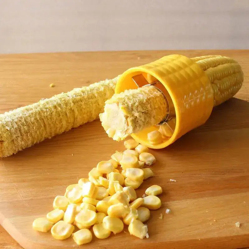 a corn corn on a cutting board with a knife