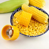 corn kernels in a bowl with a knife