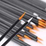 a close up of a black and orange paint brush