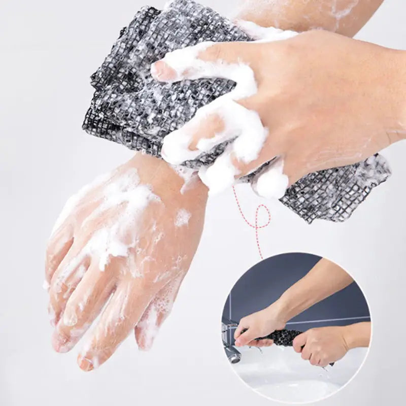 a person washing their hands with soap