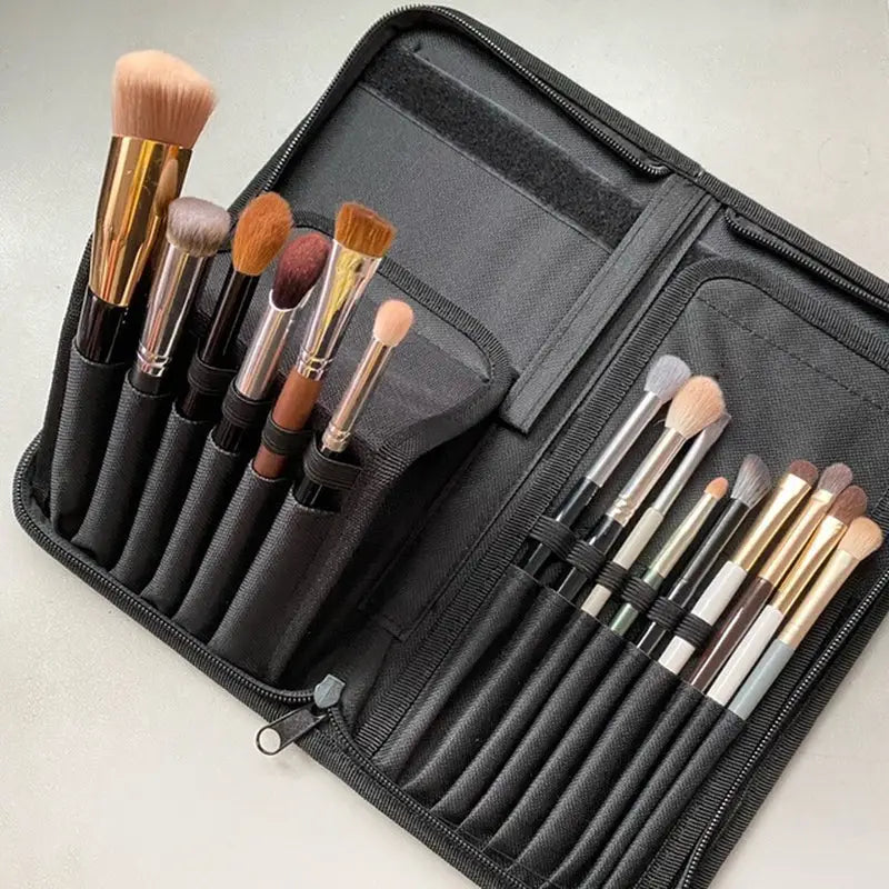 a black makeup case with brushes and brushes