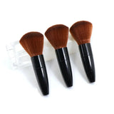 three brushes in a clear container