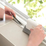 a person using a window sealer to clean the window