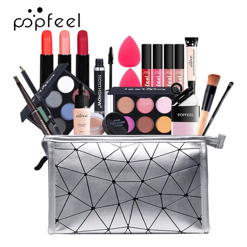 a silver cosmetic bag filled with various makeup products