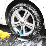 a car is washing the tires with a sponge