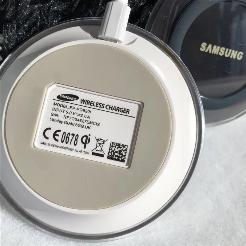 Cream-colored samsung qi wireless charger with 10w usb power and usb c connection and white charging cable