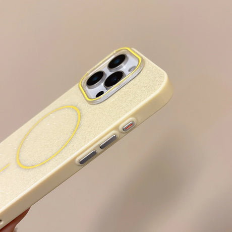Back of a cream-colored glitter wireless charge phone case for iphone with yellow magnetic charging pad and trim