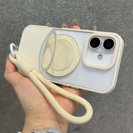 Cream-colored iPhone case with a circular pop-out stand and a matching wrist strap.