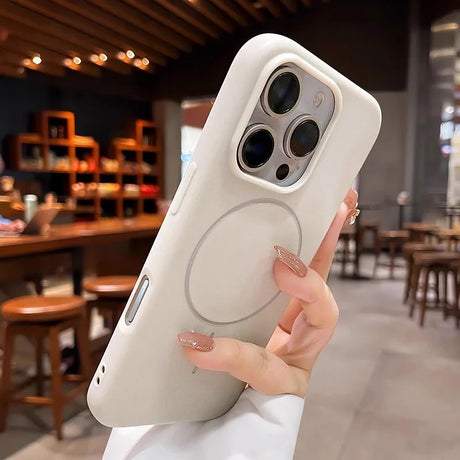 Cream-colored iPhone case with a circular magnetic ring and triple camera cutouts.