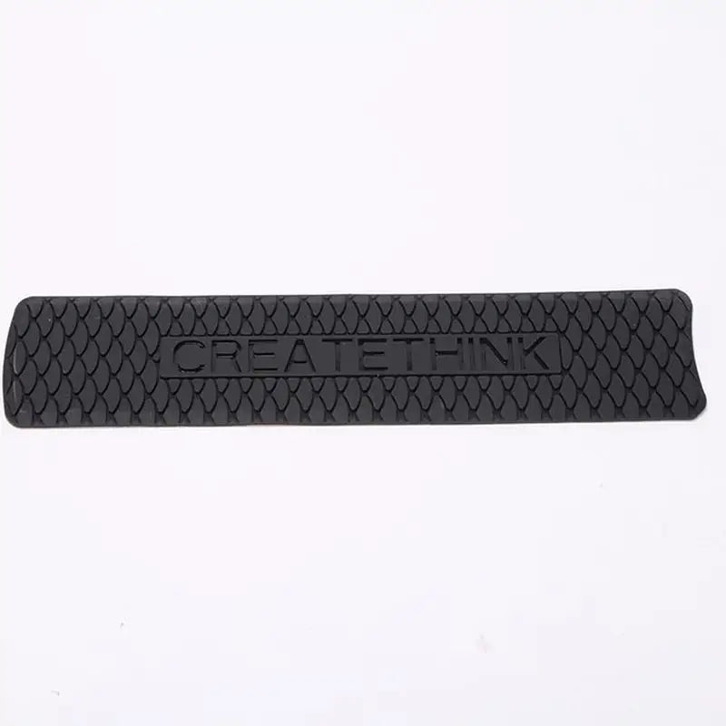 a black rubber foot pad with the word’’’on it