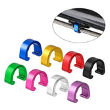 a set of four colorful plastic clips