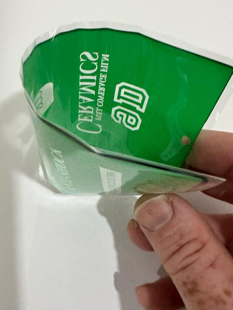Crinkled green and white package.
