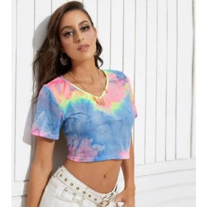 a woman wearing a tie dye crop top