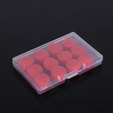 a plastic box with red heart shaped candles