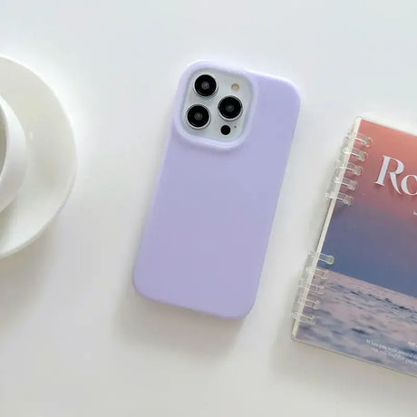 A cup of coffee and a book on a table