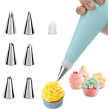 a cupcake being piped with a pastry cutter