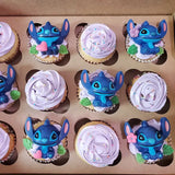 there are many cupcakes with different designs on them in a box