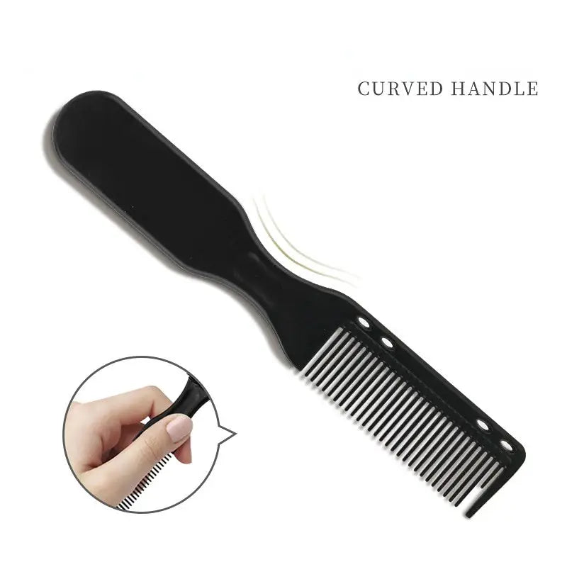 a black comb with a hand holding it