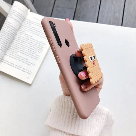 a person holding a phone case with a dog on it