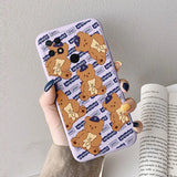 a woman holding a phone case with a cartoon bear pattern