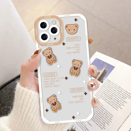 a woman holding a phone case with a bear design