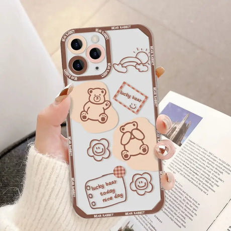 a woman holding a phone case with a cartoon design