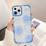 a woman holding a phone case with a blue bear pattern