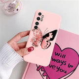 a woman holding a pink phone case with a butterfly on it