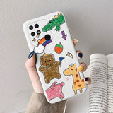 a hand holding a phone case with a cartoon bear and other animals