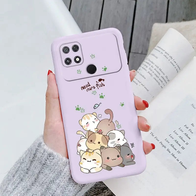a woman holding a phone case with a cartoon animal