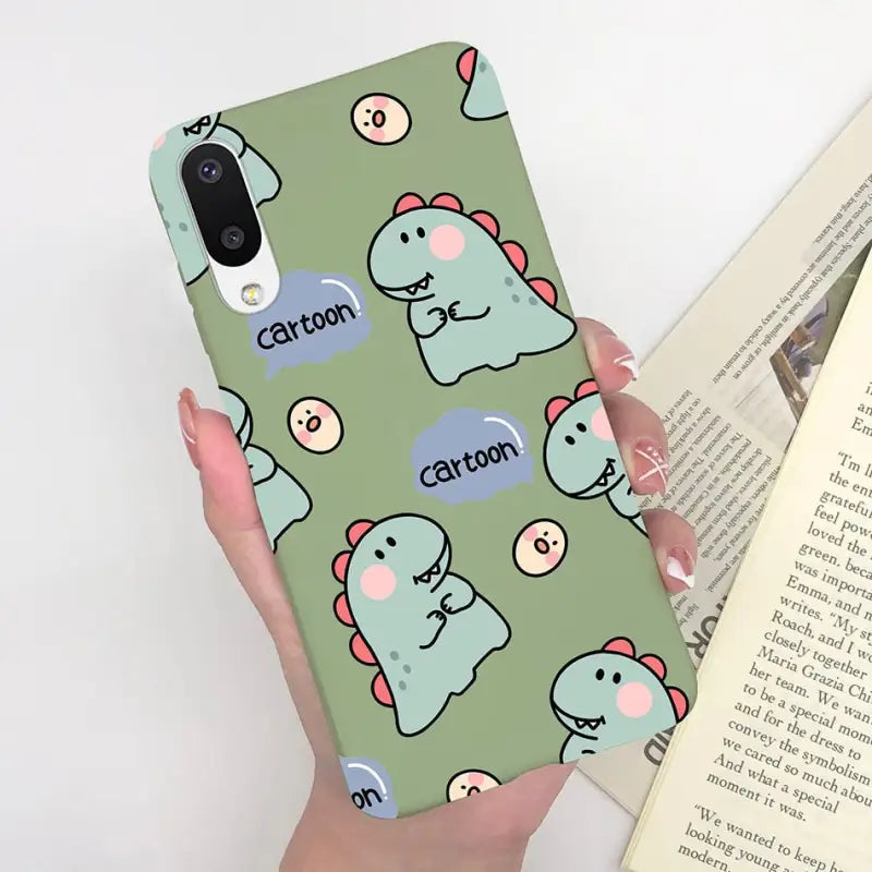 a person holding a phone case with a pattern of cats