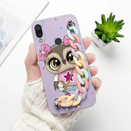 a person holding a phone case with a unicorn on it