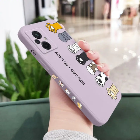 a woman holding a purple phone case with cartoon characters on it