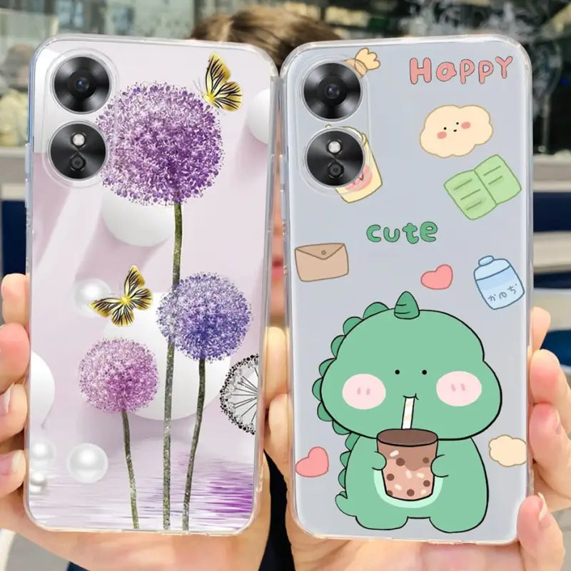 a person holding up two phone cases with cartoon characters on them
