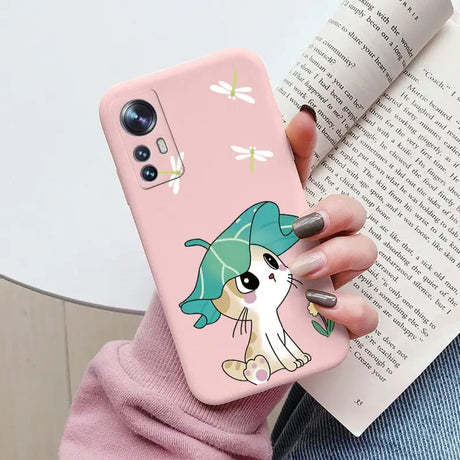 a girl holding a phone case with a cartoon character on it