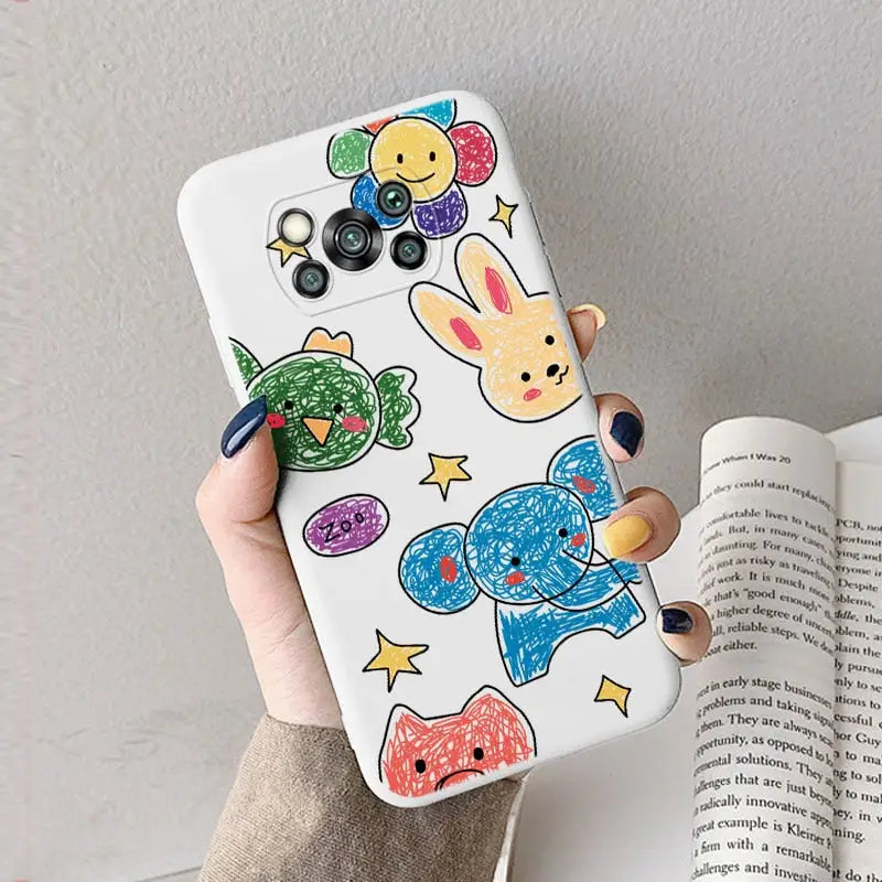 a hand holding a phone case with colorful fish and fish drawings
