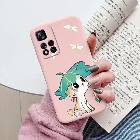 a girl holding a phone case with a cartoon character on it