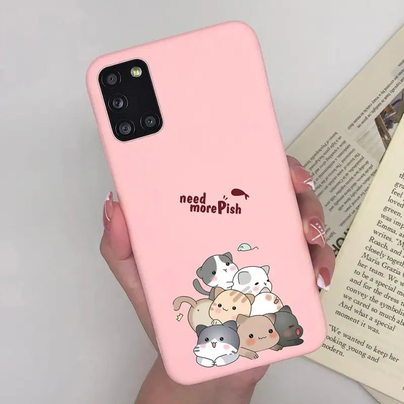 a woman holding a pink phone case with a cartoon cat and dog