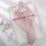 a pink towel with a cat face on it
