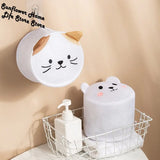a white toilet paper holder with a cat face