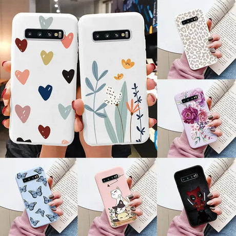 a woman holding a phone case with various designs